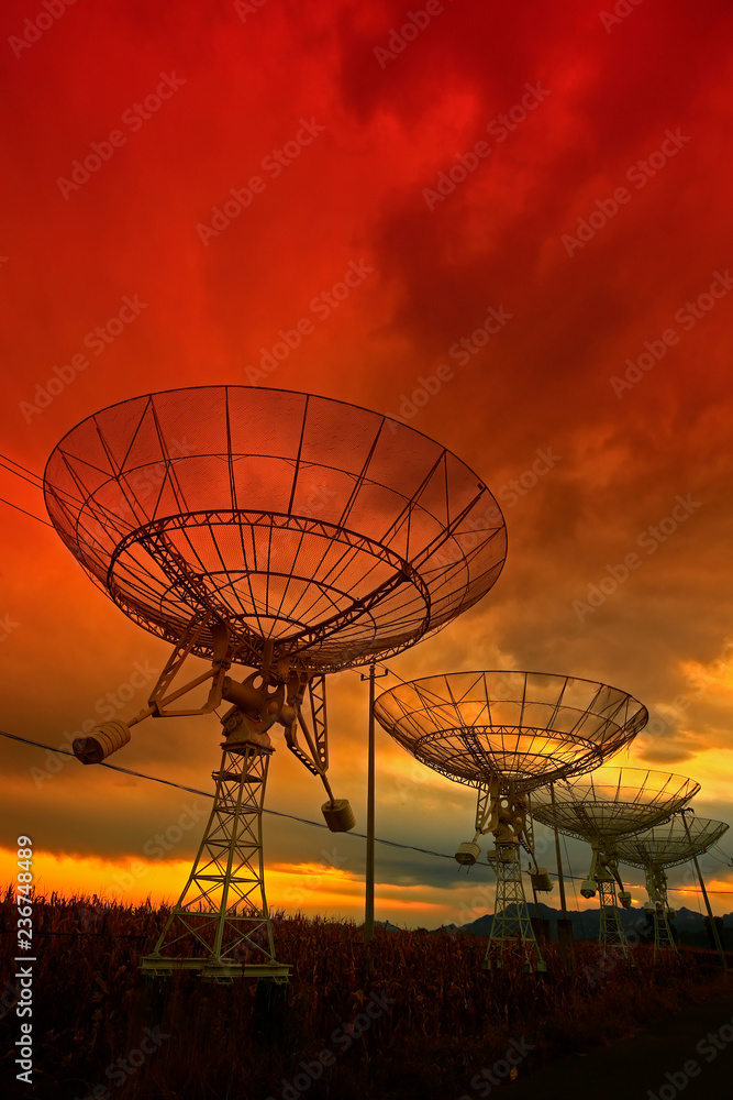 The silhouette of a radio telescope observatory The silhouette of a radio telescope observatory