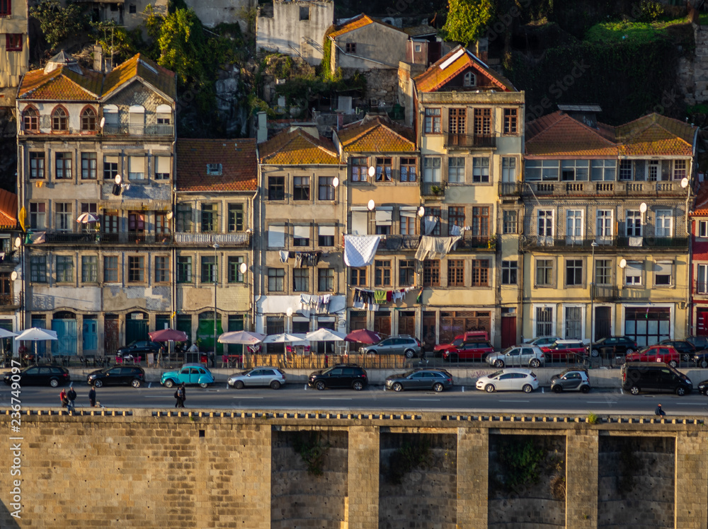 typicall and colorfull house of porto in portugal with dom luis bridge as frame