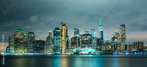 Manhattan panoramic skyline at night from Brooklyn Bridge Park. New York City, USA. Office buildings and skyscrapers at Lower Manhattan (Downtown Manhattan).. © resul
