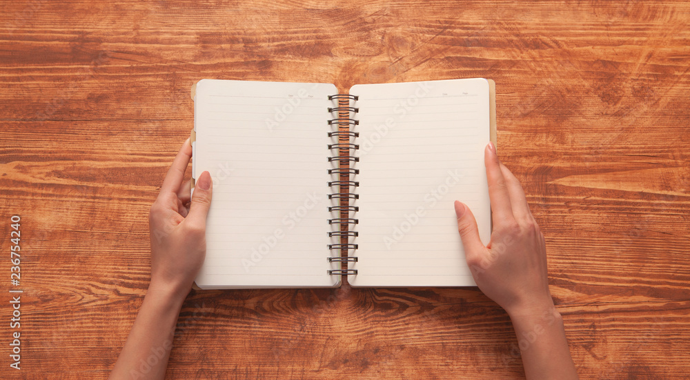 hand notebook wooden background hand notebook wooden background