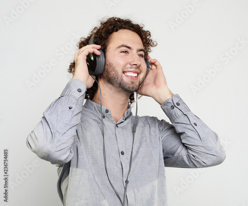 Enjoying the sound of music. Studio portrait of handsome young man with headphones.