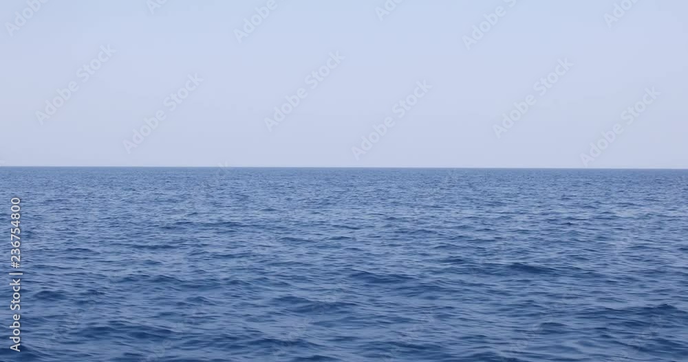 Shot of sea waves moving fast with horizon line recorded on a boat moving forward on the ocean. Shot of sea waves moving fast with horizon line recorded on a boat moving forward on the ocean.