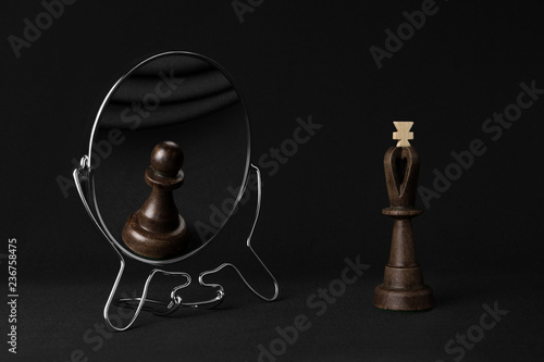 black king sees a black pawn in the mirror photo