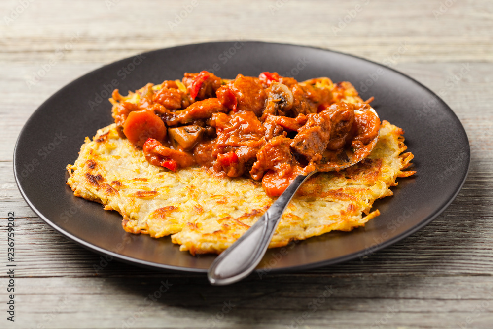 Hungarian potato pancake with goulash Hungarian potato pancake with goulash
