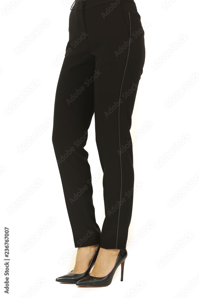 summer printed white cotton trousers on model legs with white stiletto heels summer printed white cotton trousers on model legs with white stiletto heels