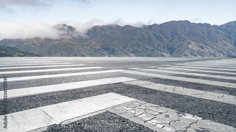 Fototapeta premium Panoramic skyline and mountains with empty road 