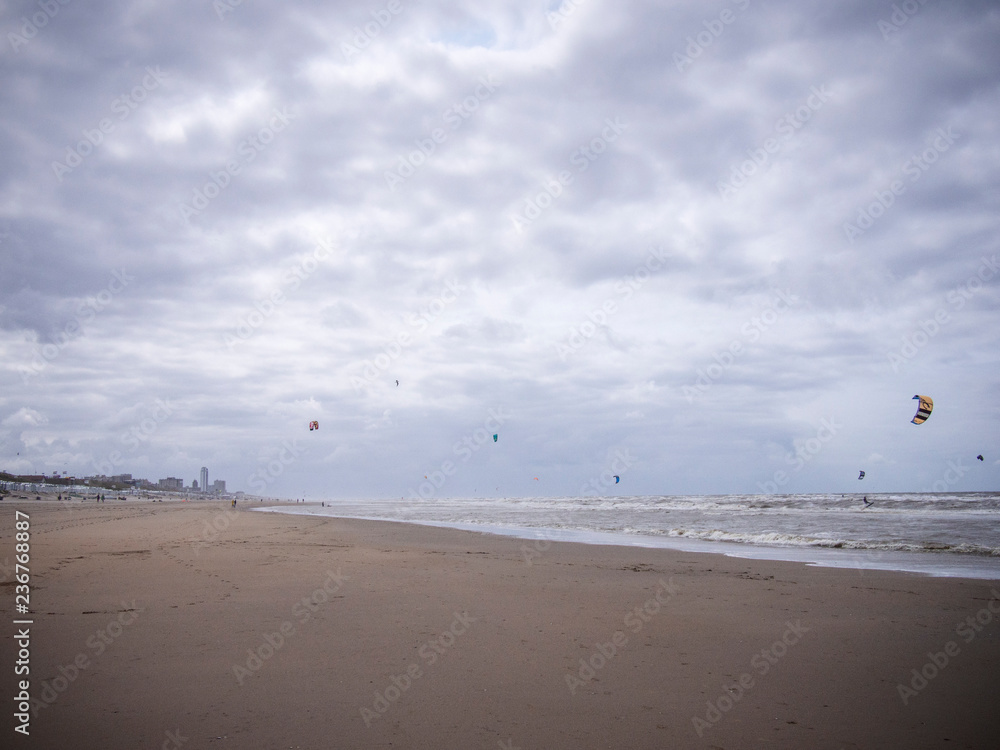 stormy beach day with clouds and kitesurfing at bloomingdale beach