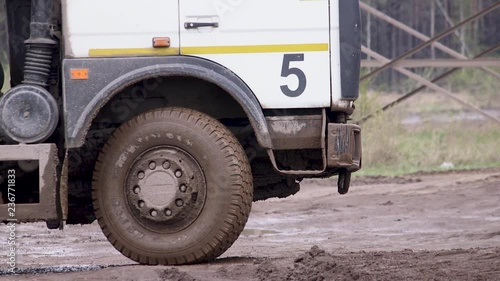 8.	dump truck wheel. Dirty wheel from the truck. Close-up. Car rides.