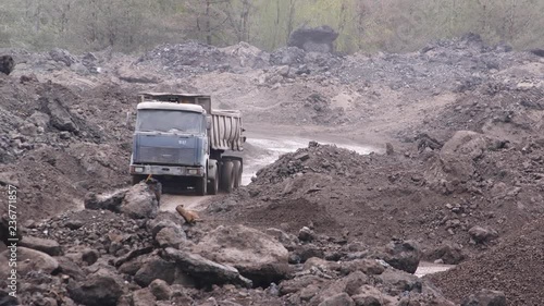 A large truck full of waste goes to the quarry. Lucky waste (metal) for recycling.