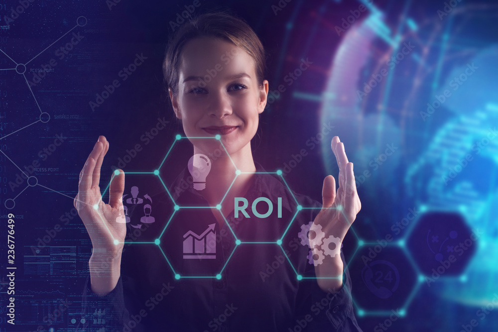 The concept of business, technology, the Internet and the network. A young entrepreneur working on a virtual screen of the future and sees the inscription: ROI The concept of business, technology, the Internet and the network. A young entrepreneur working on a virtual screen of the future and sees the inscription: ROI