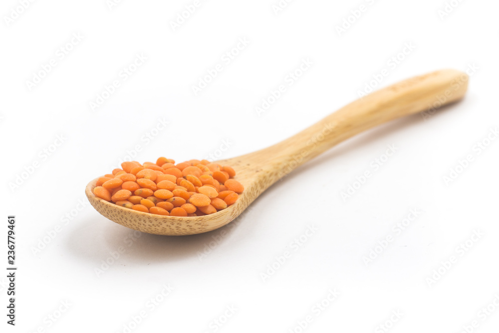 Red lentils in a spoon Red lentils in a spoon