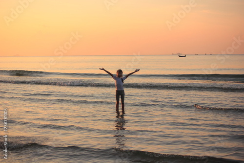 Relax  and Happy child girl sunset on the Beach. © Chaleow