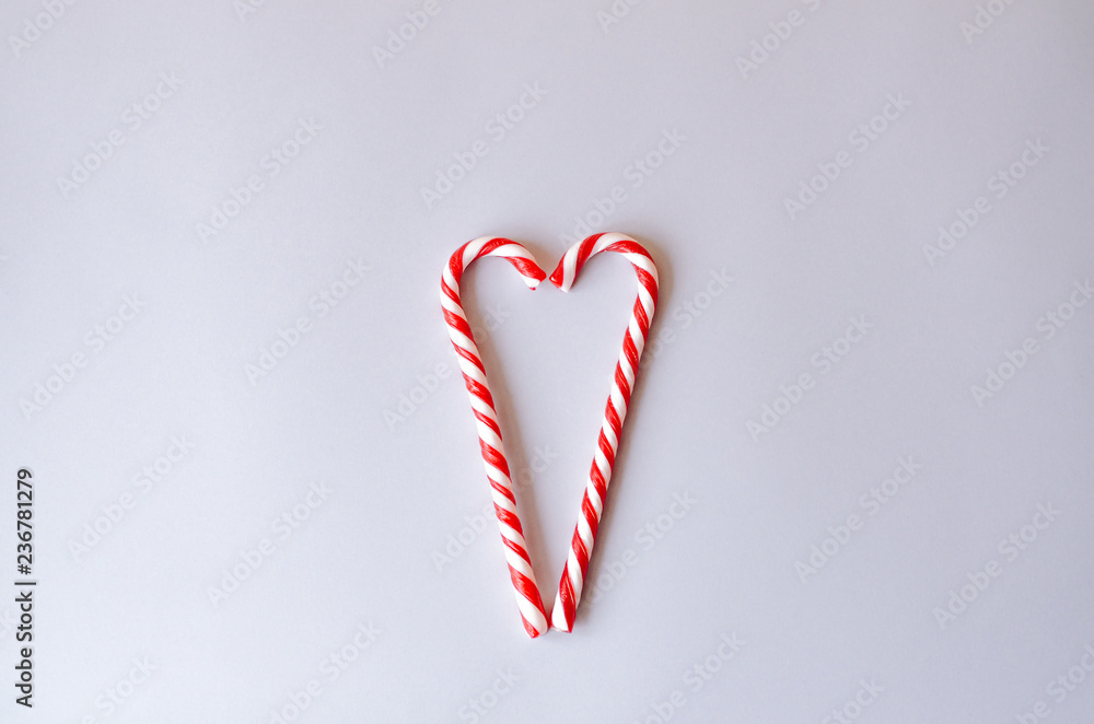 Two canes heart shaped candy. Two canes heart shaped candy.