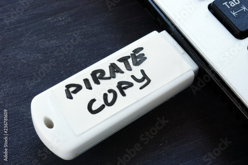 Принти на полотні Pirate copy written on a flash drive. Copyright law.