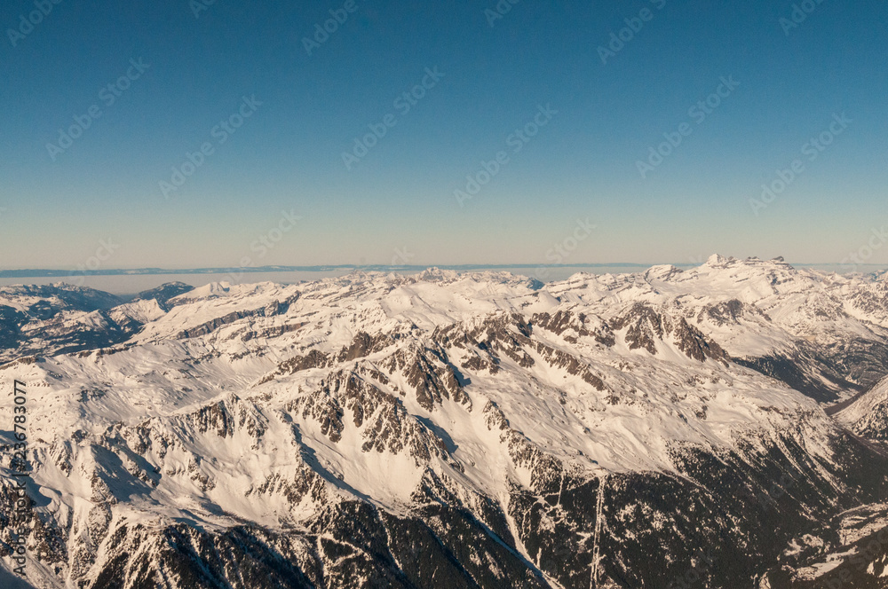 View over the French Alps, from the Aiguille du Midi cable on a winter afternoon, just before Christmas.