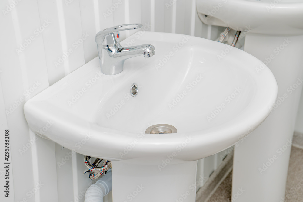Fototapeta premium The photo of a sink in a bathroom