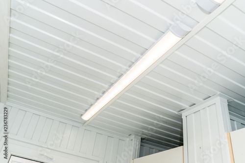 Bright chandelier on a white ceiling