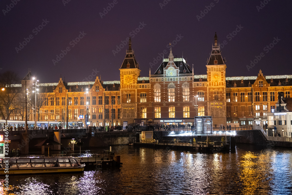 Amsterdam/Netherland - November 24: Street of Amsterdam during winter weekend. The street crowed with trallver and local people waking and doing activity.