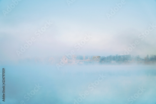 Morning fog on the lake in the frosty morning