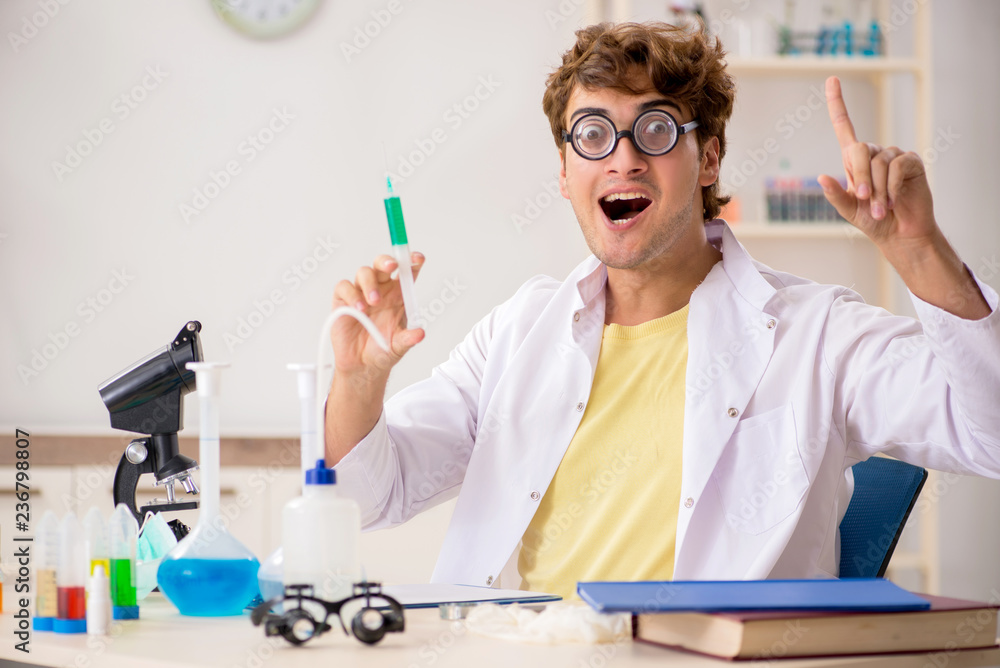 Funny crazy chemist doing experiments and tests Funny crazy chemist doing experiments and tests