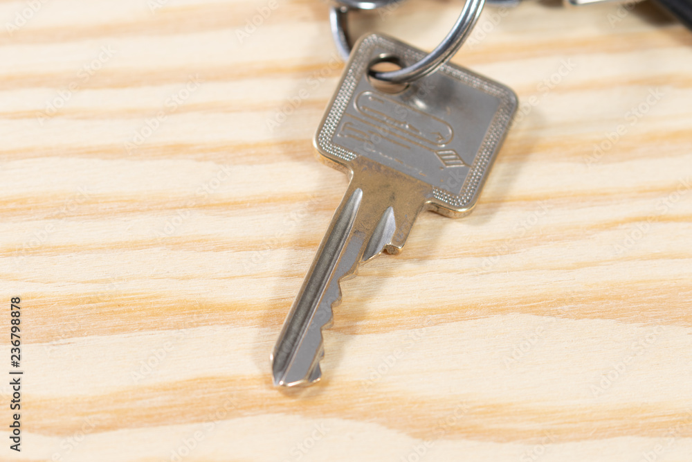 bunch of old keys on wooden background bunch of old keys on wooden background