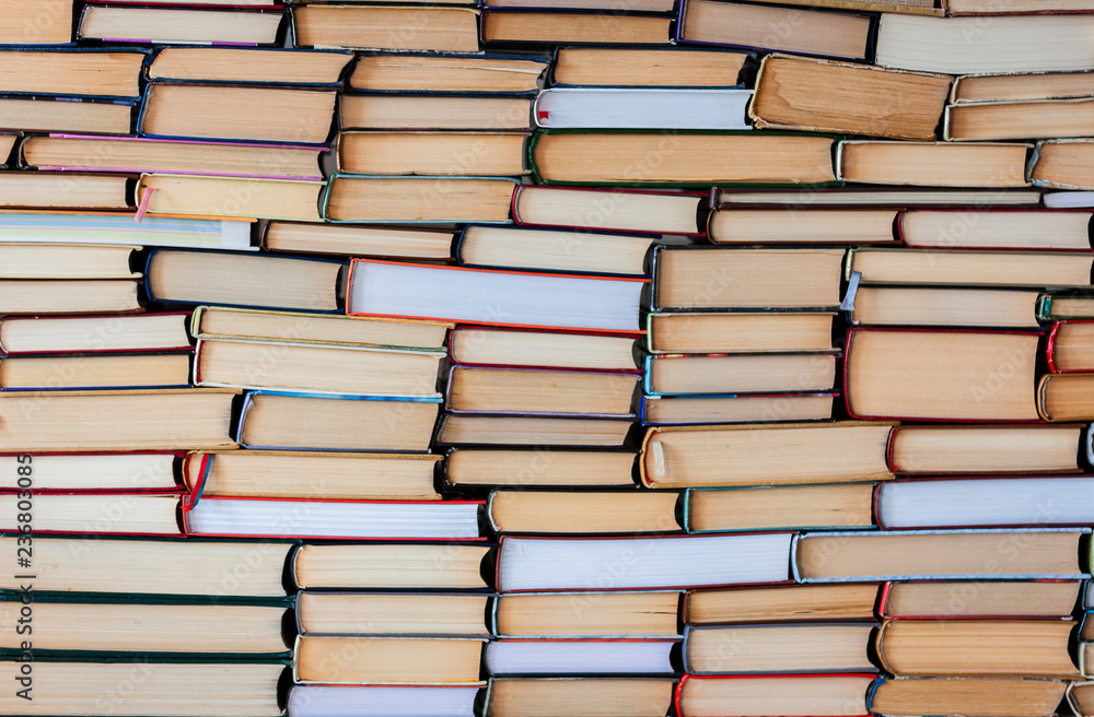 Stack of books background, many books piles with copy space for text Stack of books background, many books piles with copy space for text