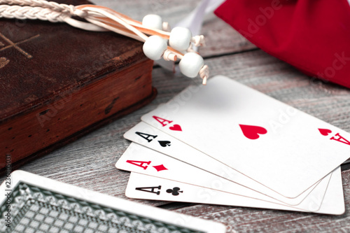 Old holy bible and cards on wooden table. Misticism and fortune telling, future prediction concept photo