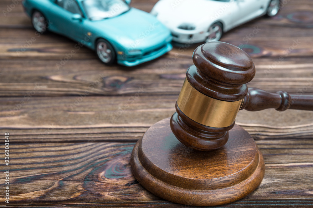 hammer of the judge. two collided cars. The concept of liability for traffic violations. Accident, insurance, compensation, crash. hammer of the judge. two collided cars. The concept of liability for traffic violations. Accident, insurance, compensation, crash.