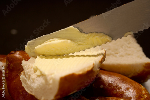 Fresh pretzel with sausage and cheese is a tasty snack