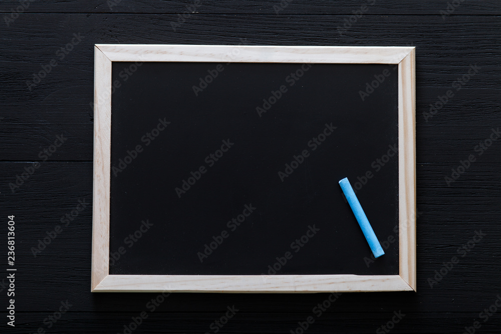 White wooden frame with chalk inside on blackboard, back to school background, primary education, kids creativity development, dark desk for drawing, art table, view from above, copy space for text White wooden frame with chalk inside on blackboard, back to school background, primary education, kids creativity development, dark desk for drawing, art table, view from above, copy space for text