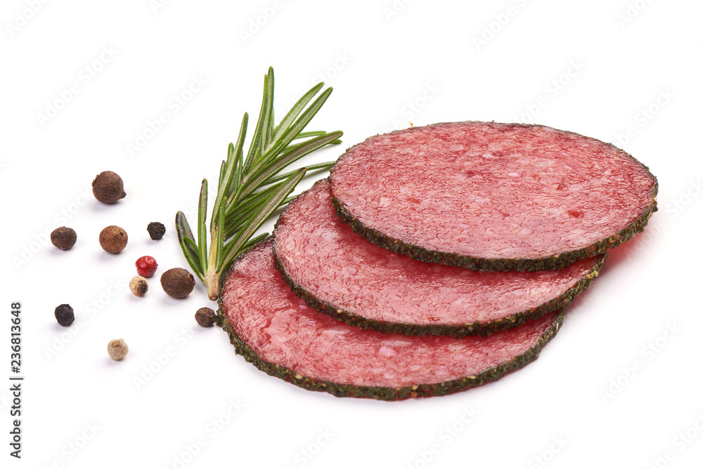 Thin Salami Slices with herbs and spices, isolated on a white background. Close-up Thin Salami Slices with herbs and spices, isolated on a white background. Close-up