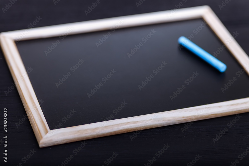 Back to school concept, colored pencils on black table, multicolored stationery accessories for educator teaching kid drawing on empty wooden desk, creative education background, top view, copy space Back to school concept, colored pencils on black table, multicolored stationery accessories for educator teaching kid drawing on empty wooden desk, creative education background, top view, copy space