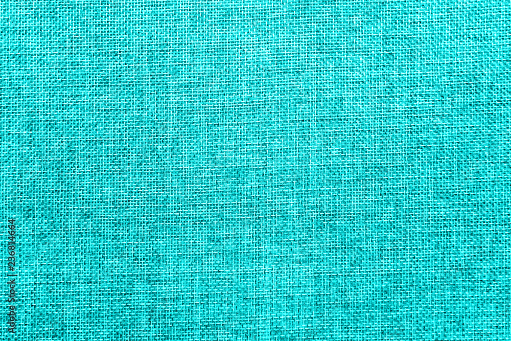 Burlap background colored in turquoise blend