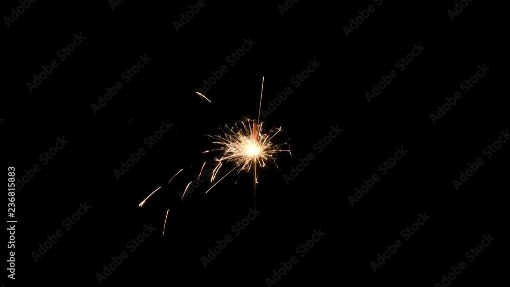 Sparkler burning on black background Sparkler burning on black background