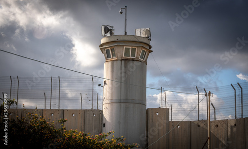 Guard tower and border wall between Israel and Palestine in Bethlehem photo