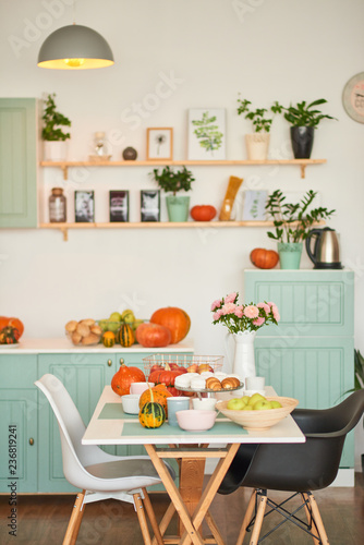 autumn kitchen decoration with pumpkins © Aleksandr