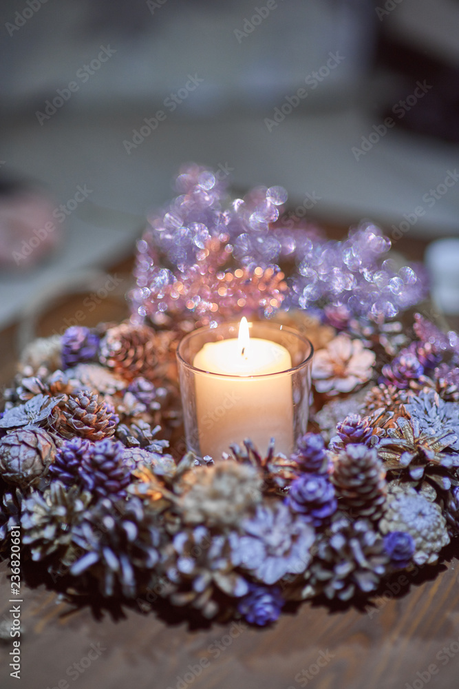 Advent decoration, wreath, candle. In the dark a candle in a beautiful decorative wreath is burning. Advent decoration, wreath, candle. In the dark a candle in a beautiful decorative wreath is burning.