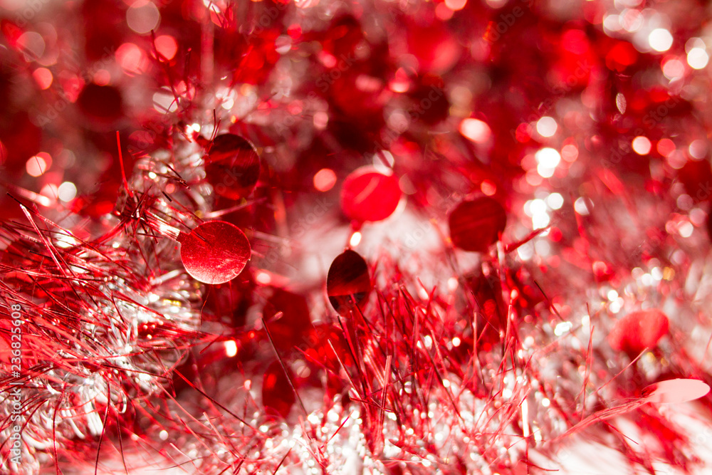 Colorful Christmas tinsel. New year's fluffy gold tinsel, and pink tinsel. Sparkling ornament decoration concept.