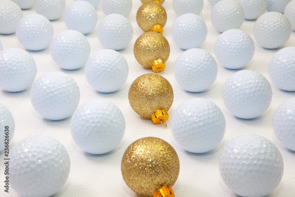 Pattern with white golf balls and gold Christmas decoration Pattern with white golf balls and gold Christmas decoration