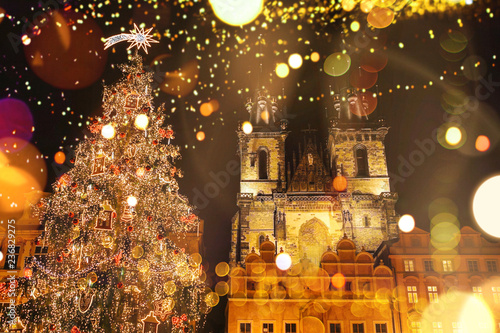 Photography Decorated Christmas tree stands on the main square in Prague during the New Year holidays