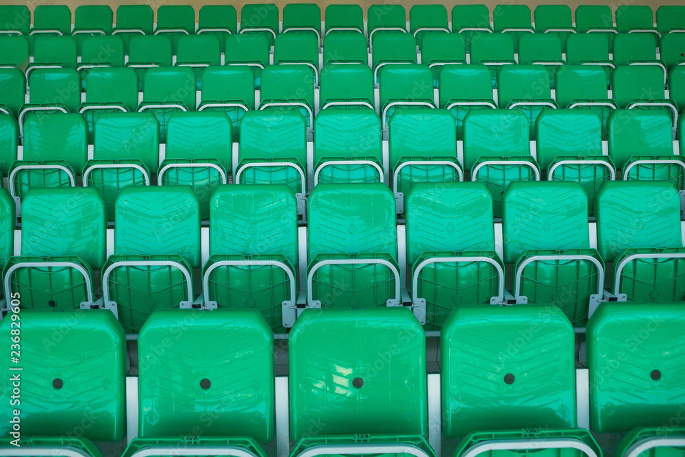 Fototapeta premium Yellow chairs inside the stadium, numbered
