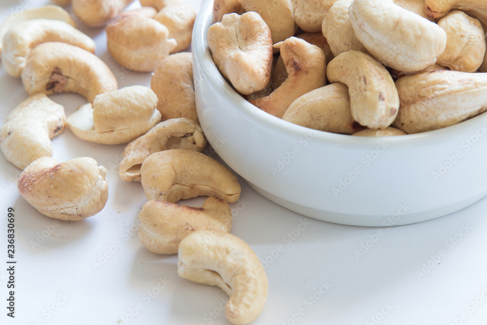 roasted cashew nuts on a white background roasted cashew nuts on a white background