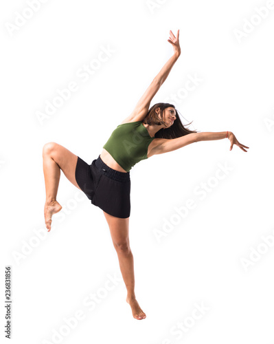 Wallpaper Mural Young girl dancing in studio on isolated background Torontodigital.ca