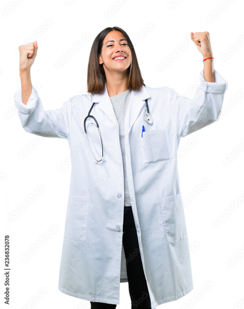 Doctor woman with stethoscope celebrating a victory in winner position on isolated white background Doctor woman with stethoscope celebrating a victory in winner position on isolated white background