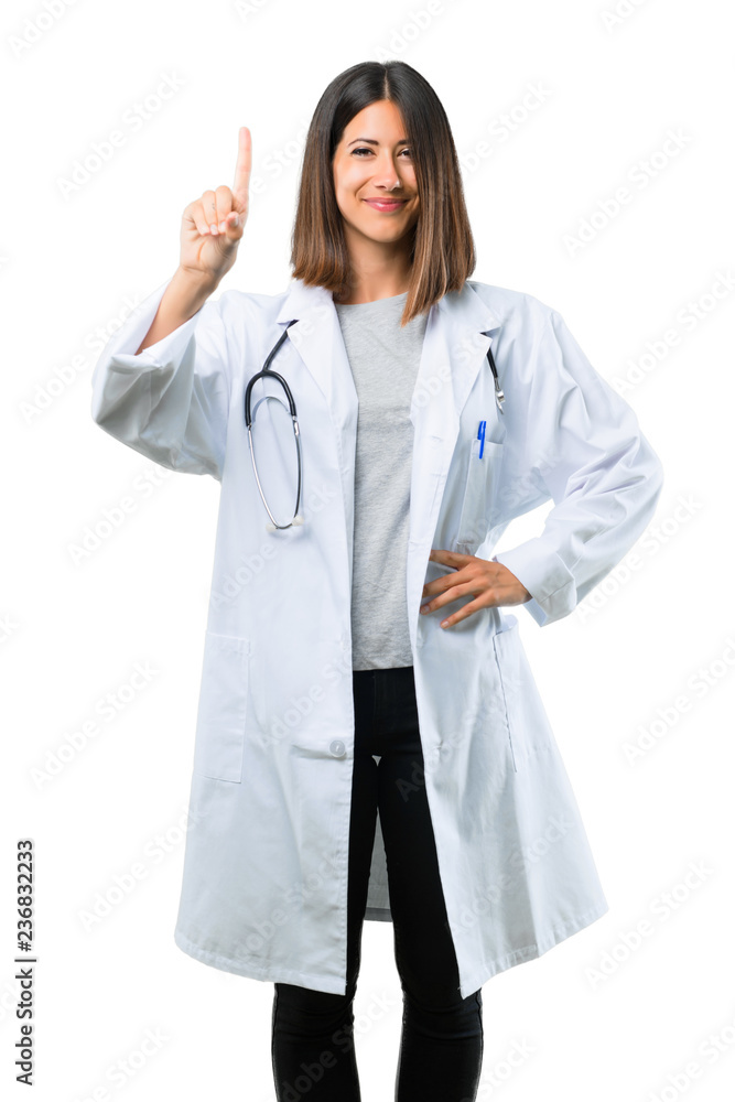Doctor woman with stethoscope showing and lifting a finger in sign of the best on isolated white background Doctor woman with stethoscope showing and lifting a finger in sign of the best on isolated white background