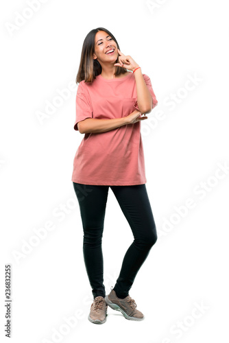 Full body of Young girl with pink shirt standing and thinking an idea while looking up