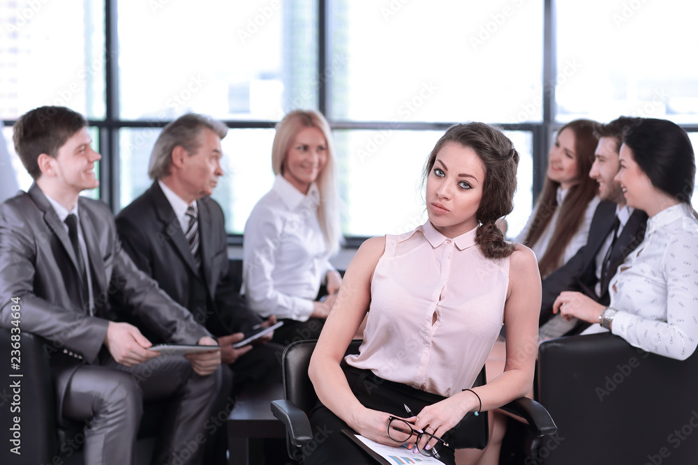 Naklejka premium business woman assistant on the background of the working group