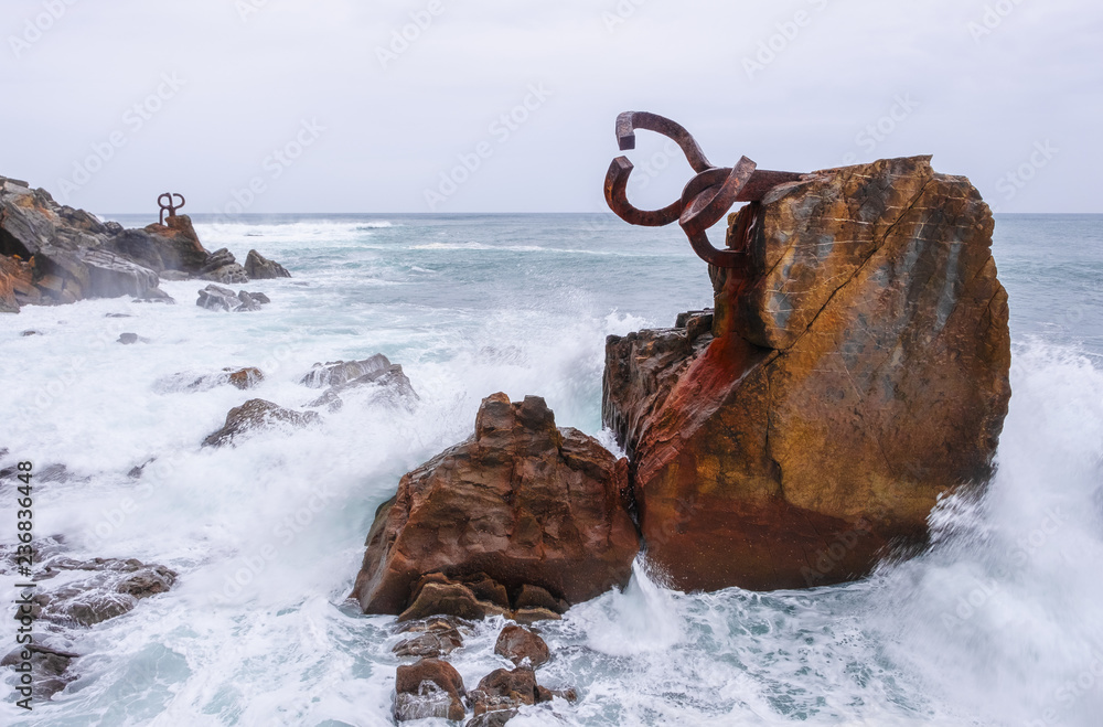 Fototapeta premium Sculpture of the Comb of the Wind ( Peine del Viento ), next to the sea, coast of the city of San Sebastian