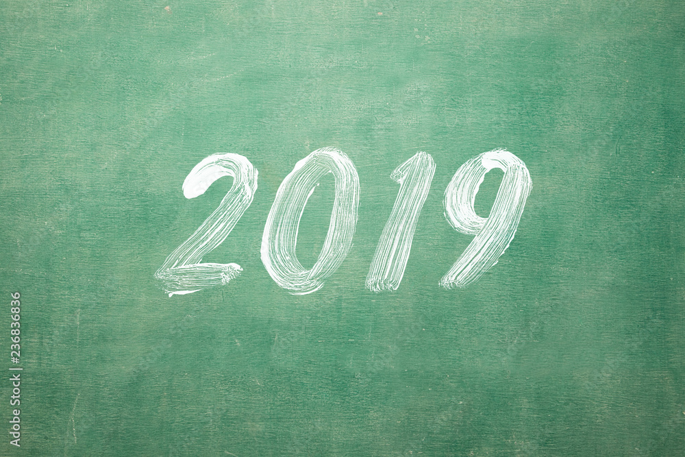 Happy New Year 2019 Hand Writting on classroom blackboard Happy New Year 2019 Hand Writting on classroom blackboard