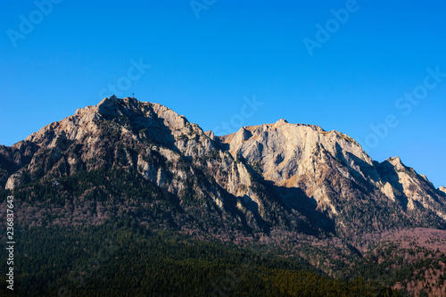 Bucegi Mountains and Caraiman peak as seen from the Cantacuzino Palace, Busteni mountain resort, Prahova Valley, Romania